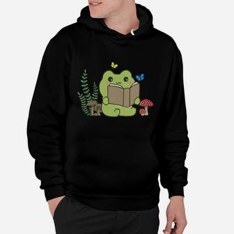 Womens Cute Frog Reading A Book On Mushroom Cottagecore Aesthetic Hoodie | Crazezy