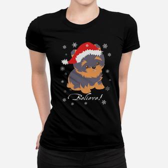 Cute Yorkie Puppy In Santa Hat And Snowflakes Believe Women T-shirt - Monsterry DE