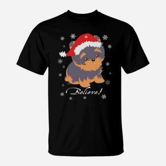 Cute Yorkie Puppy In Santa Hat And Snowflakes Believe T-Shirt - Monsterry UK
