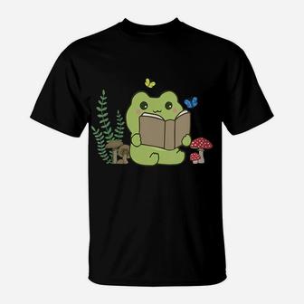 Womens Cute Frog Reading A Book On Mushroom Cottagecore Aesthetic T-Shirt | Crazezy
