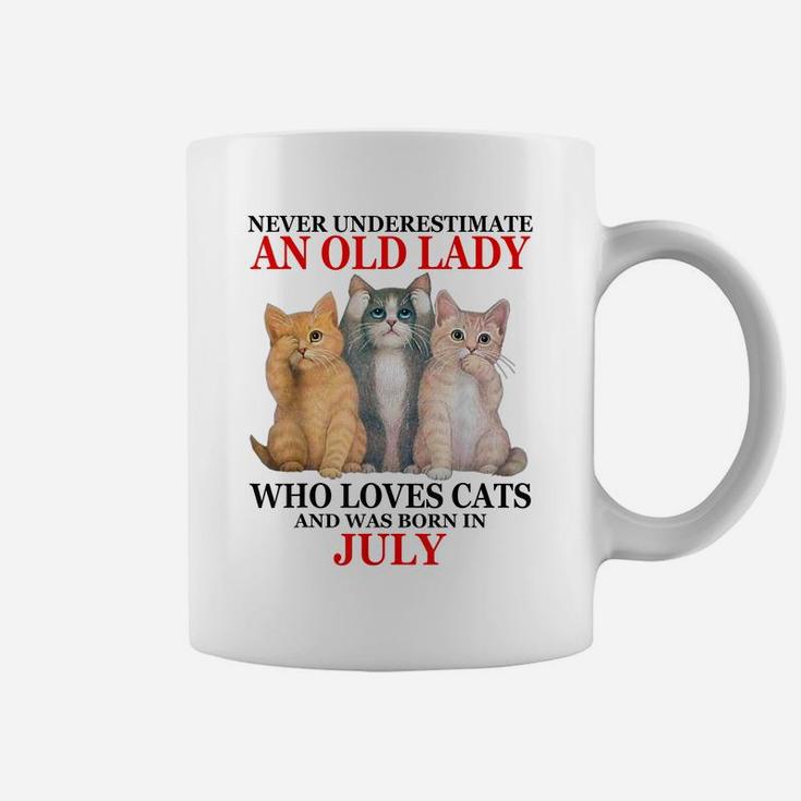 Never Underestimate An Old Lady Who Loves Cats - July Coffee Mug