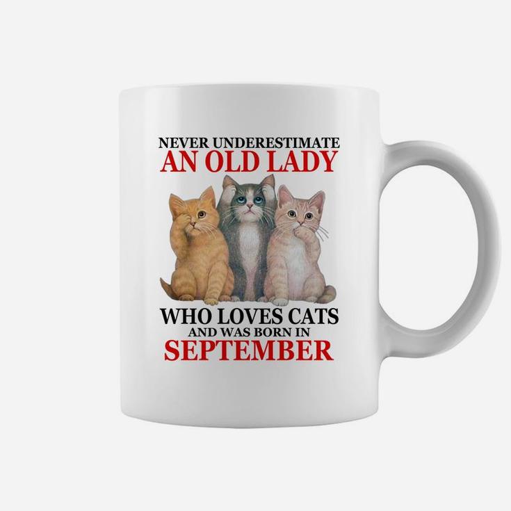 Never Underestimate An Old Lady Who Loves Cats - September Coffee Mug