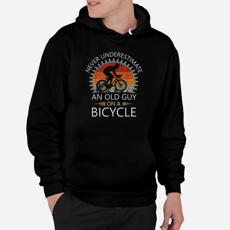 An Old Guy On A Bicycle Cycling Vintage Never Underestimate Hoodie