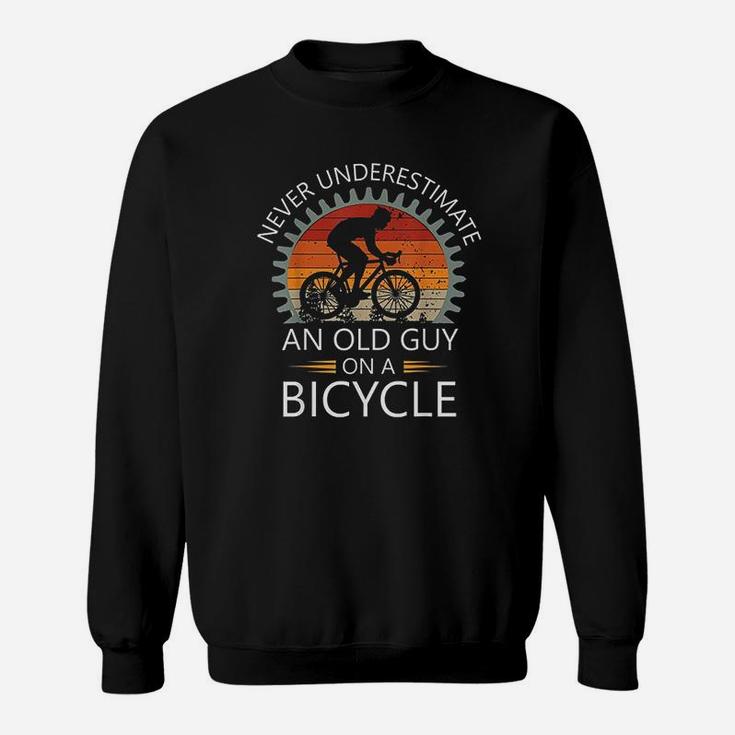 An Old Guy On A Bicycle Cycling Vintage Never Underestimate Sweatshirt